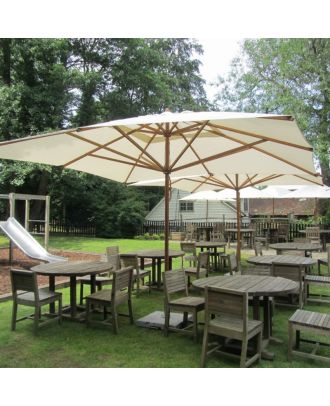 2 large square parasols shading a pub terrace 