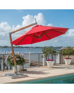small cantilever parasol with red canopy and rotating base on pool side