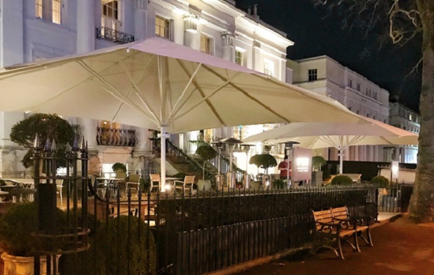 large commercial parasol on a pub terrace